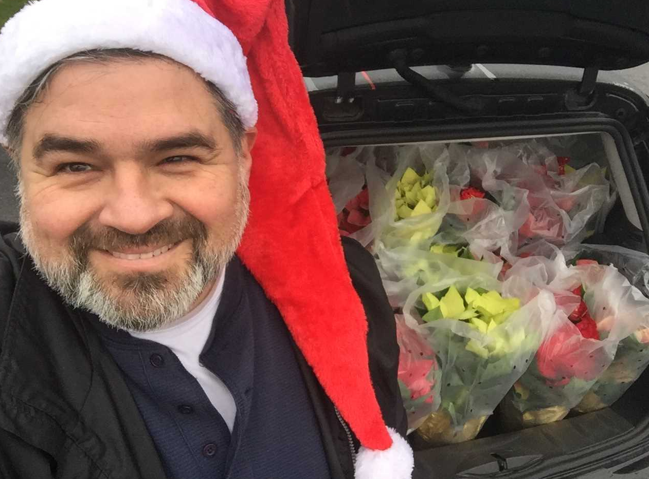 Wally Olivieri and van full of poinsettias